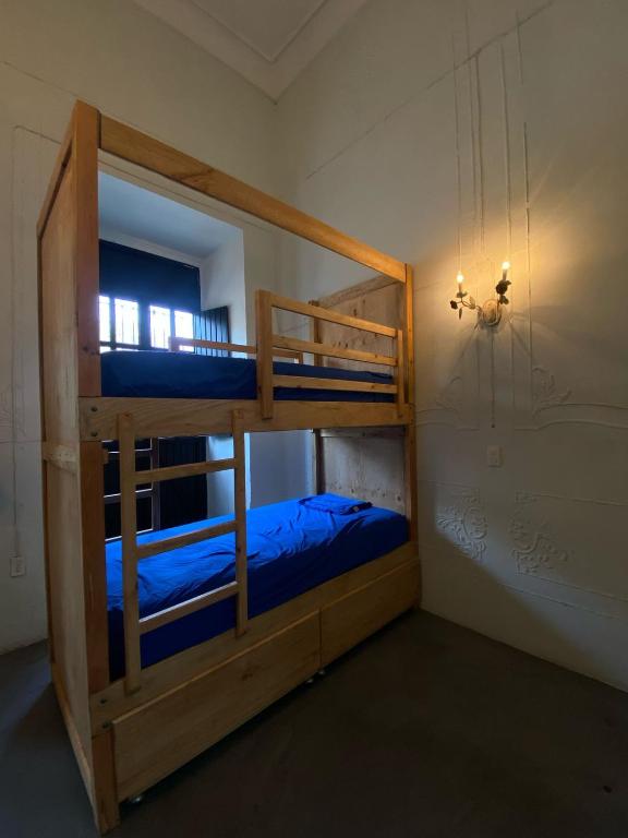 Postel nebo postele na pokoji v ubytování El Pinche Hostal
