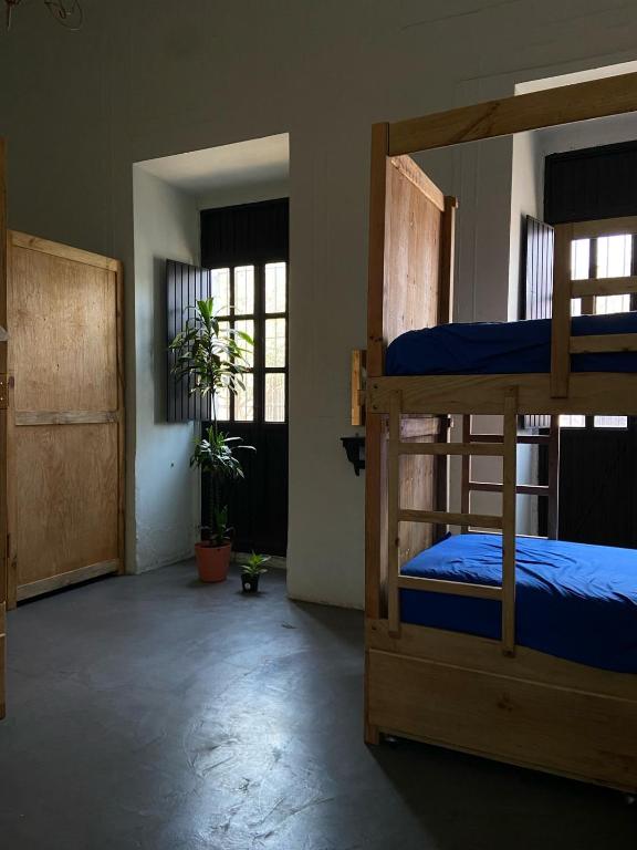 Postel nebo postele na pokoji v ubytování El Pinche Hostal
