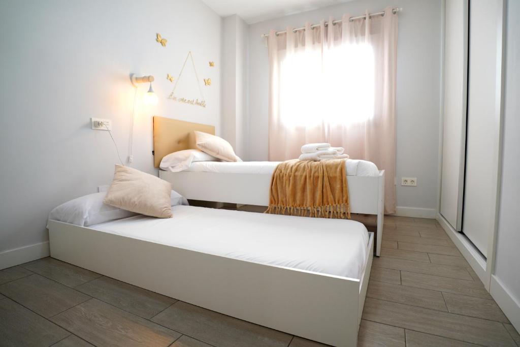Postel nebo postele na pokoji v ubytování APARTAMENTO ARENA en Playa de San Juan