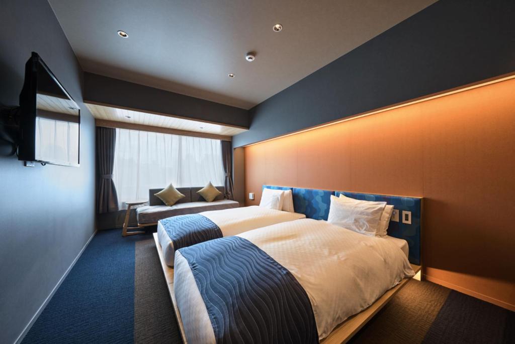 Postel nebo postele na pokoji v ubytování Minn Nijo-jo