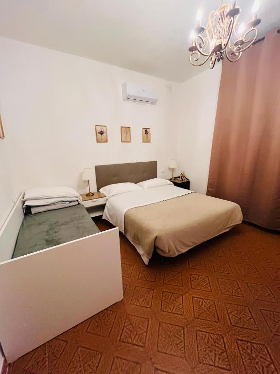 Postel nebo postele na pokoji v ubytování Pisa House