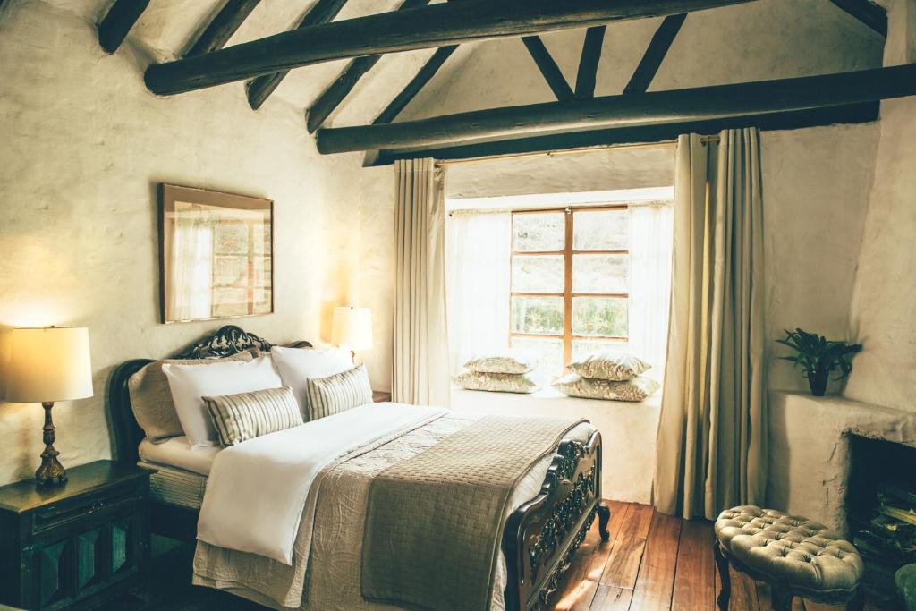 Postel nebo postele na pokoji v ubytování Hotel Hacienda Baza