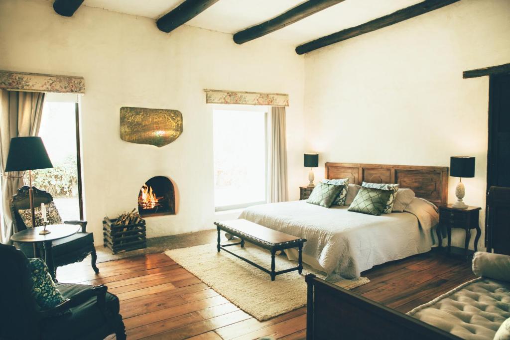 Postel nebo postele na pokoji v ubytování Hotel Hacienda Baza