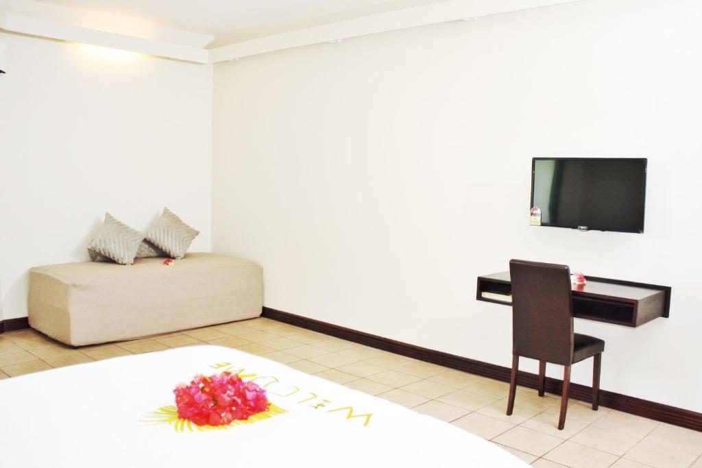 Sjónvarps- og/eða afþreyingartæki á Hotel Oasis