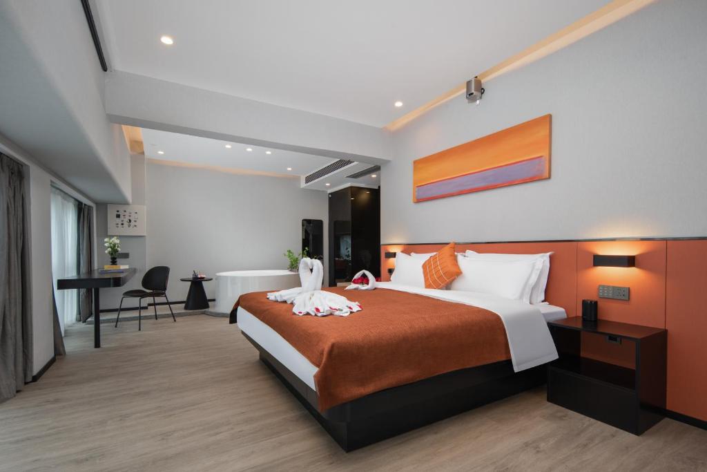 Postel nebo postele na pokoji v ubytování LlA Hotel Liang Jun Plaza, Xixiang Avenue