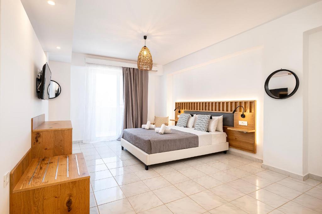 Postel nebo postele na pokoji v ubytování Aegean Bay Hotel