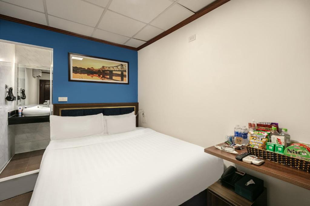 Postel nebo postele na pokoji v ubytování A25 Hotel - 19 Chả Cá