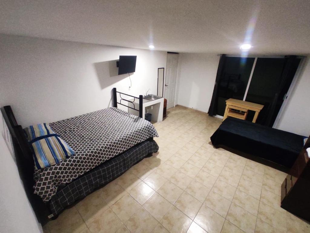 Letto o letti in una camera di Hotelito Ejido San Ale