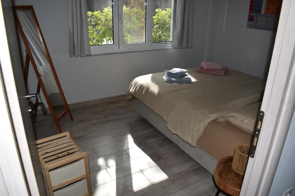 Postel nebo postele na pokoji v ubytování Gatelouzou Apartments