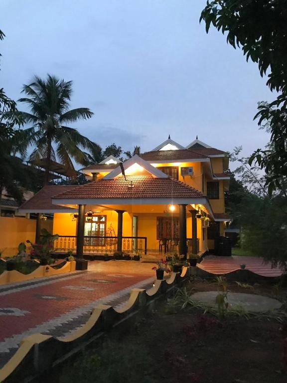 a house with a lit up front of it at sarangvilla homestay varkala,edava in Kappil