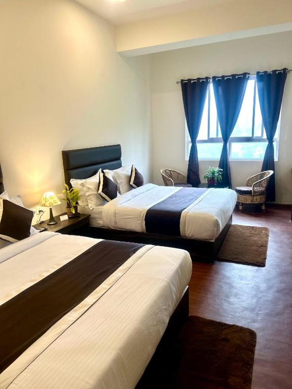 Postel nebo postele na pokoji v ubytování Hotel Mazong Crest