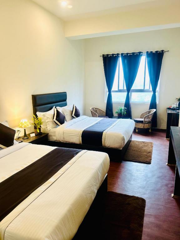 Postel nebo postele na pokoji v ubytování Hotel Mazong Crest