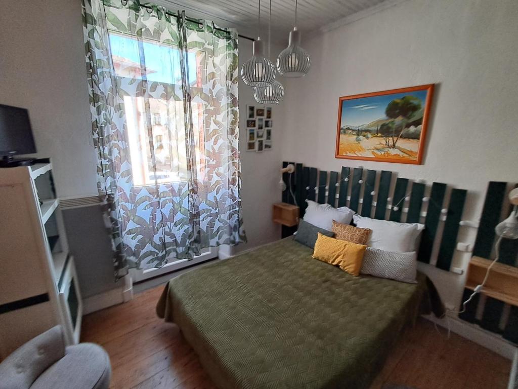 Postel nebo postele na pokoji v ubytování Le Relais De Rochepaule