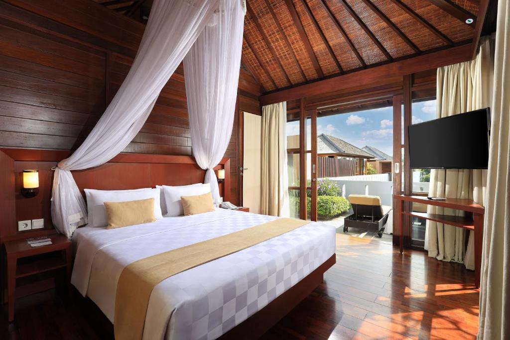Postel nebo postele na pokoji v ubytování Amadea Resort & Villas Seminyak Bali