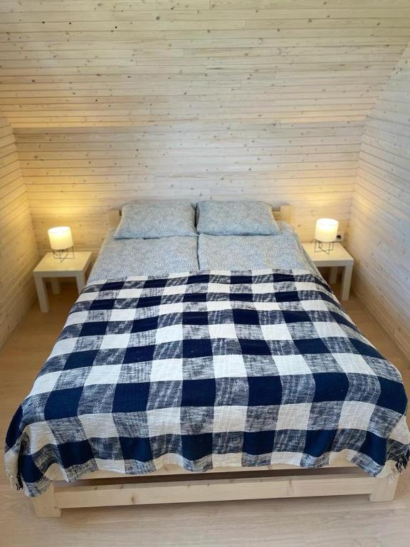 Postel nebo postele na pokoji v ubytování PoProstuDomki