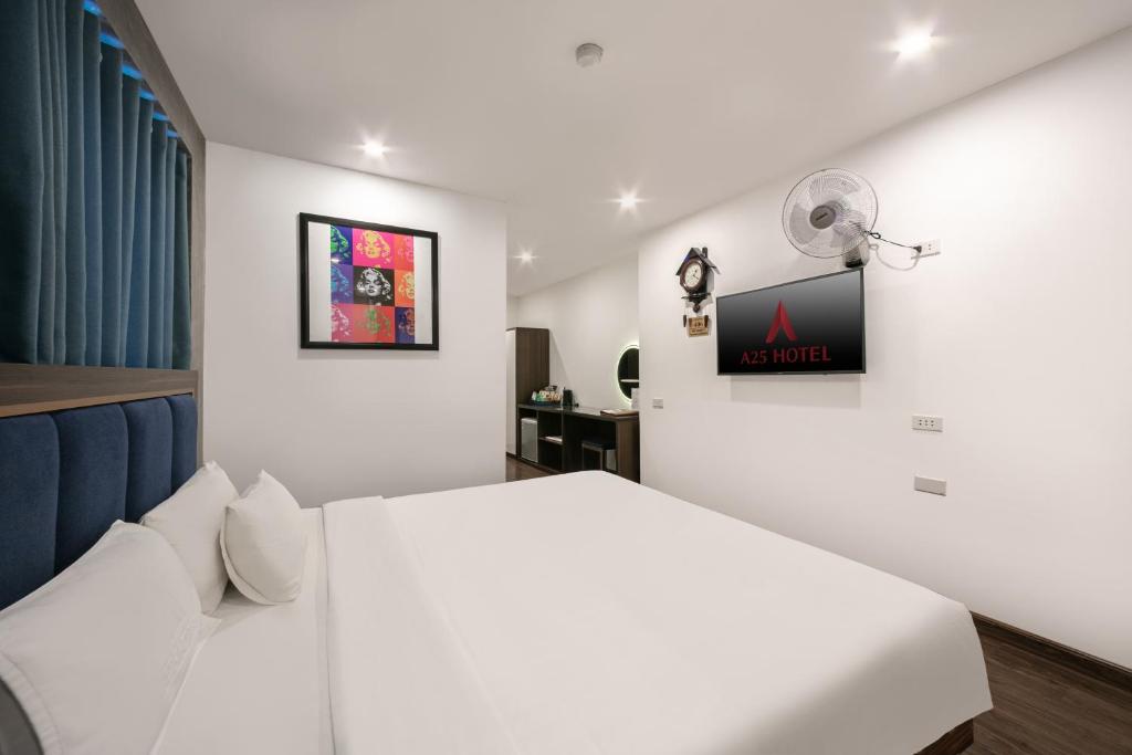 Postel nebo postele na pokoji v ubytování A25 Hotel - 19 Chả Cá