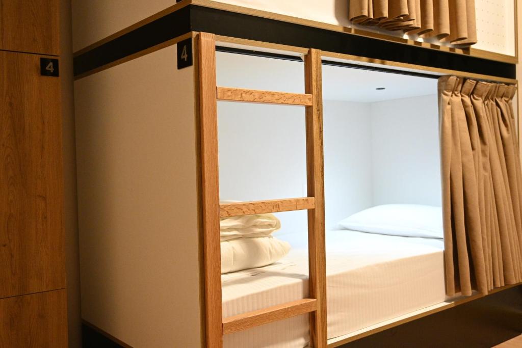 a room with a closet with a glass door at Top view hostel in Durrës
