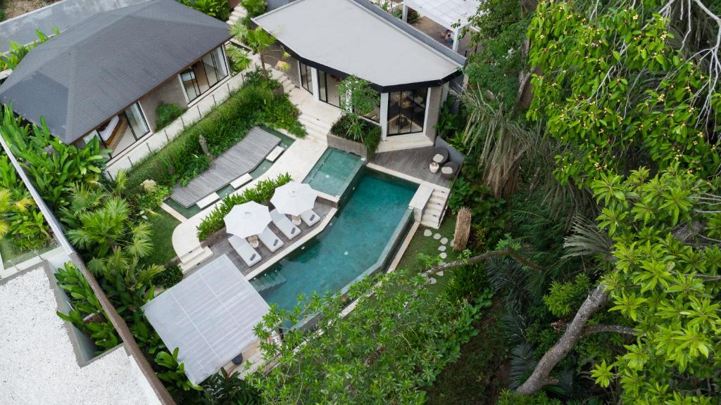 an aerial view of a house with a swimming pool at Villa Seimbang by BaliSuperHost in Ubud