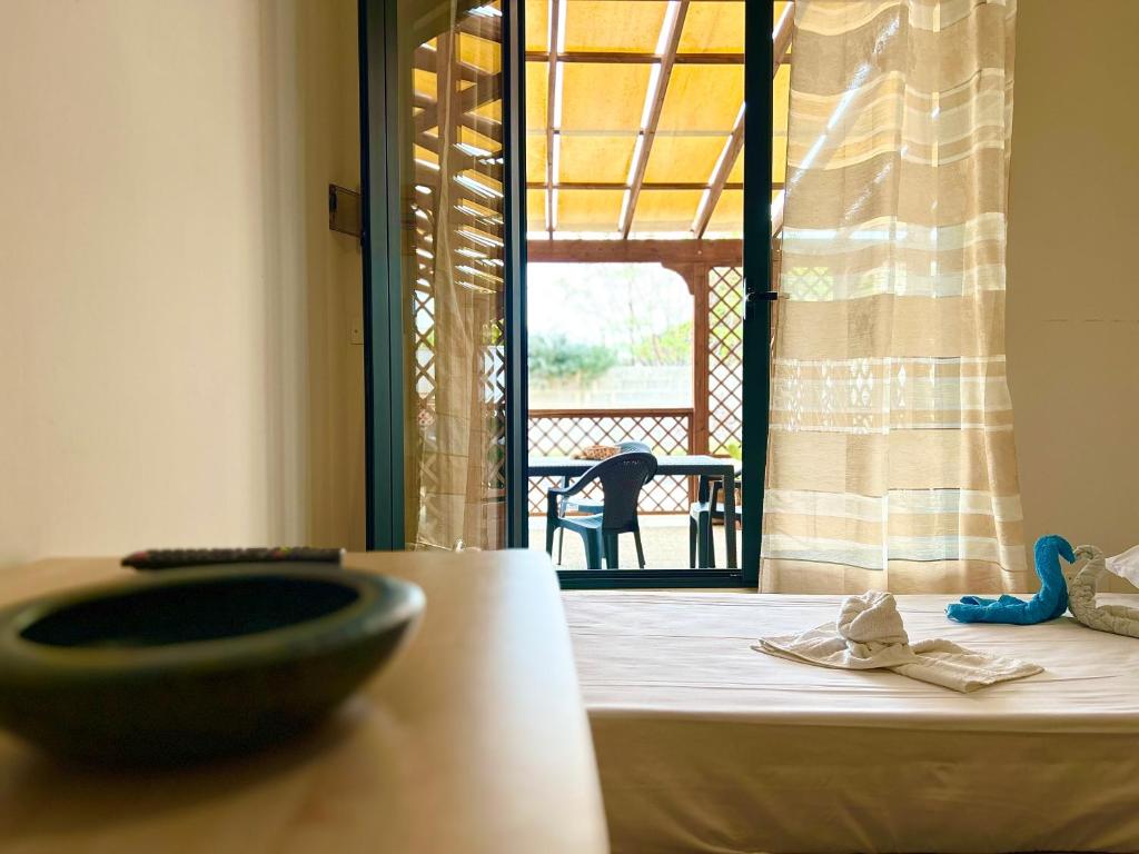 Postel nebo postele na pokoji v ubytování Casa Orchidea - Torre San Giovanni