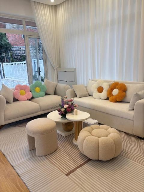 a living room with two couches with stuffed animals on them at Our Home in Da Lat