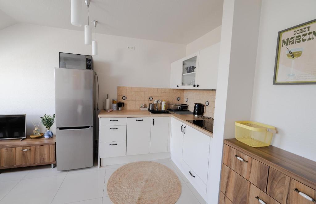 Kuchyňa alebo kuchynka v ubytovaní Słoneczny Apartament Sopot