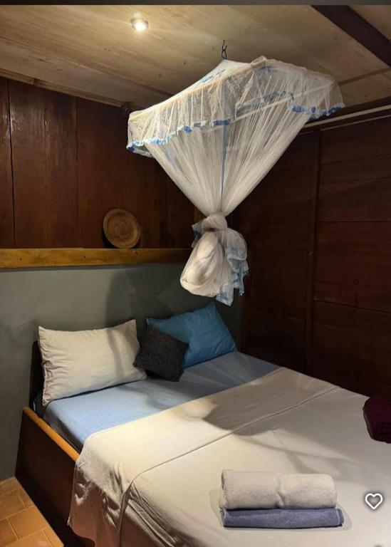 Postel nebo postele na pokoji v ubytování Cool Banyan Cabana