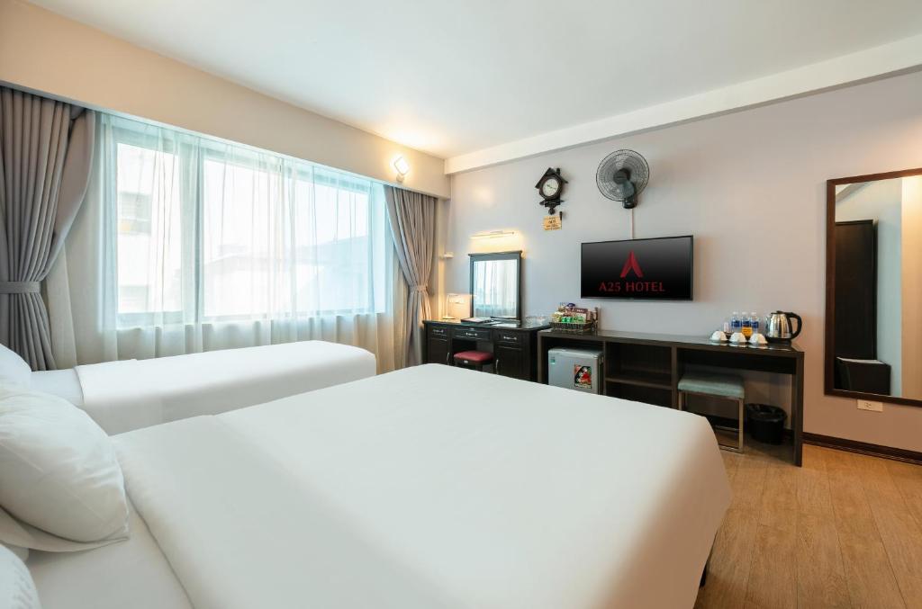 Postel nebo postele na pokoji v ubytování A25 Hotel - 88 Nguyễn Khuyến