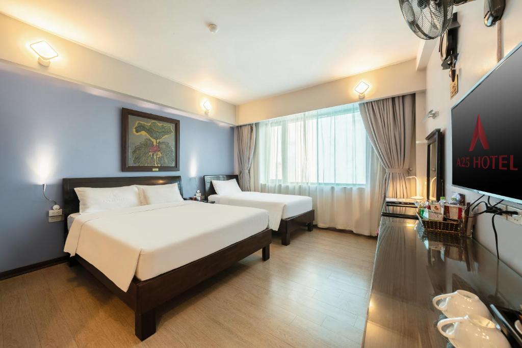 Postel nebo postele na pokoji v ubytování A25 Hotel - 88 Nguyễn Khuyến