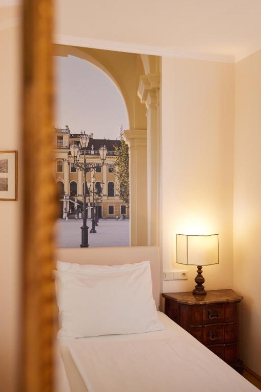 Posteľ alebo postele v izbe v ubytovaní Hotel Royal