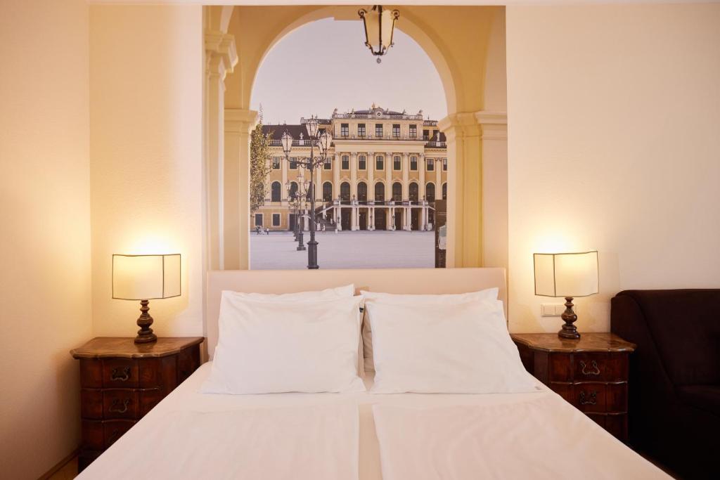 Posteľ alebo postele v izbe v ubytovaní Hotel Royal