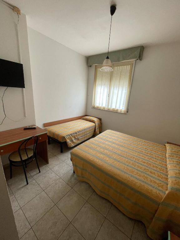 Postel nebo postele na pokoji v ubytování Hotel Zeus
