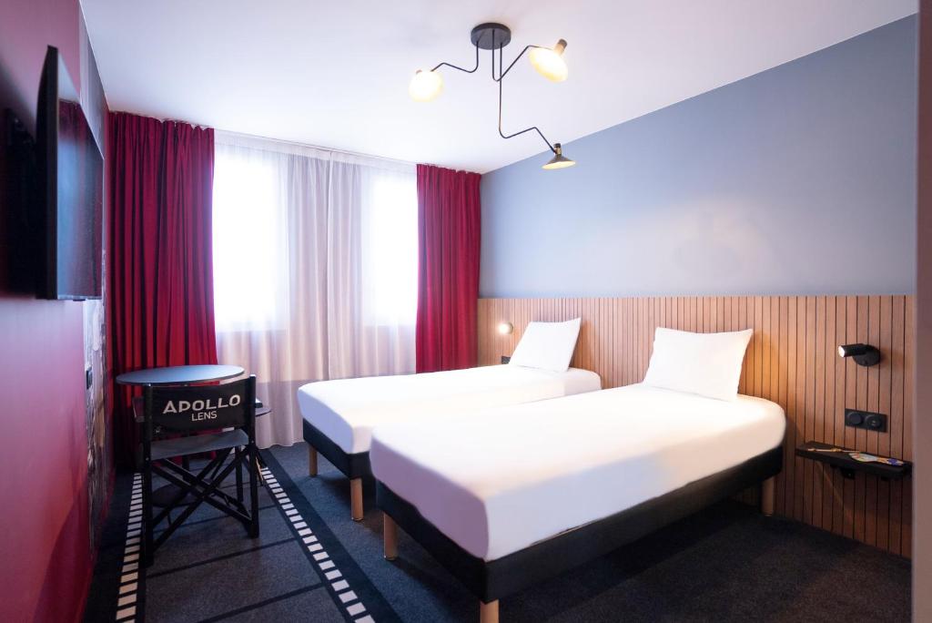Postel nebo postele na pokoji v ubytování ibis Styles Lens Centre Gare