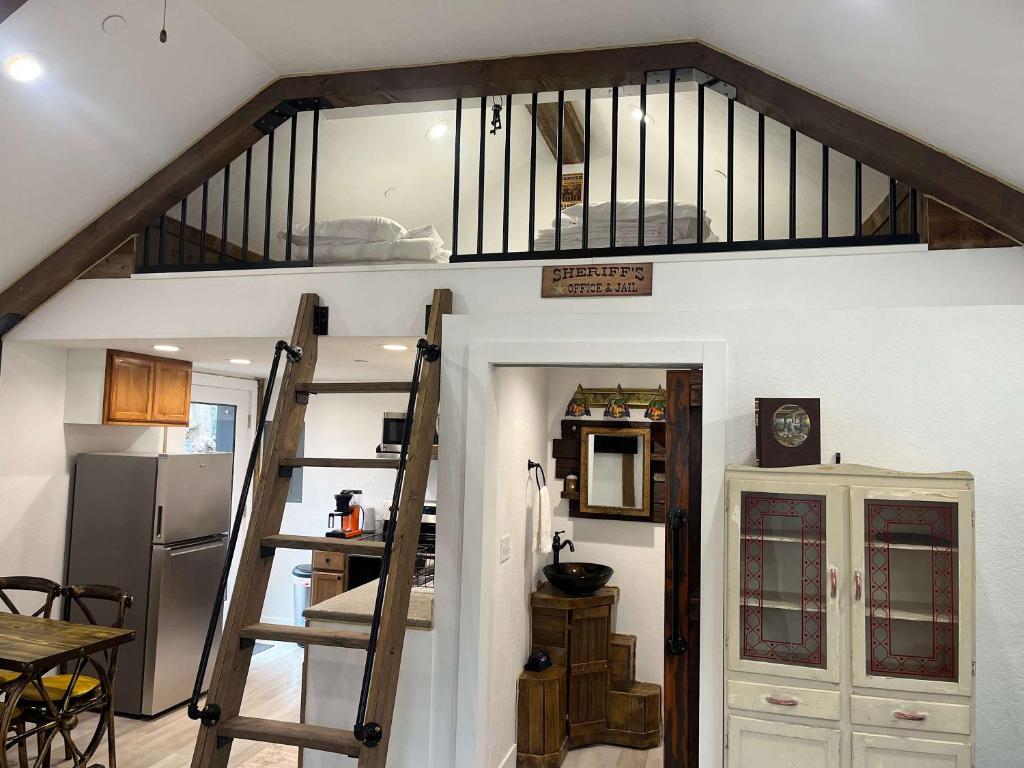a room with a staircase leading up to a loft at Watershed- IN TOWN walk to everything in Lava Hot Springs