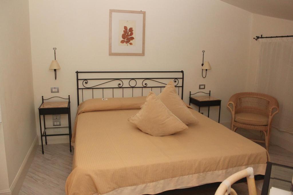 Postel nebo postele na pokoji v ubytování Hotel Sirolo