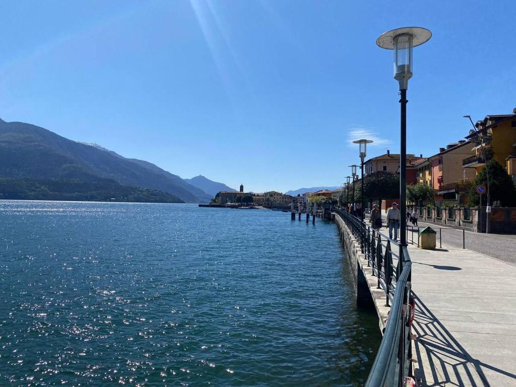 a view of a body of water with a street light at Casa Gemma in Gravedona