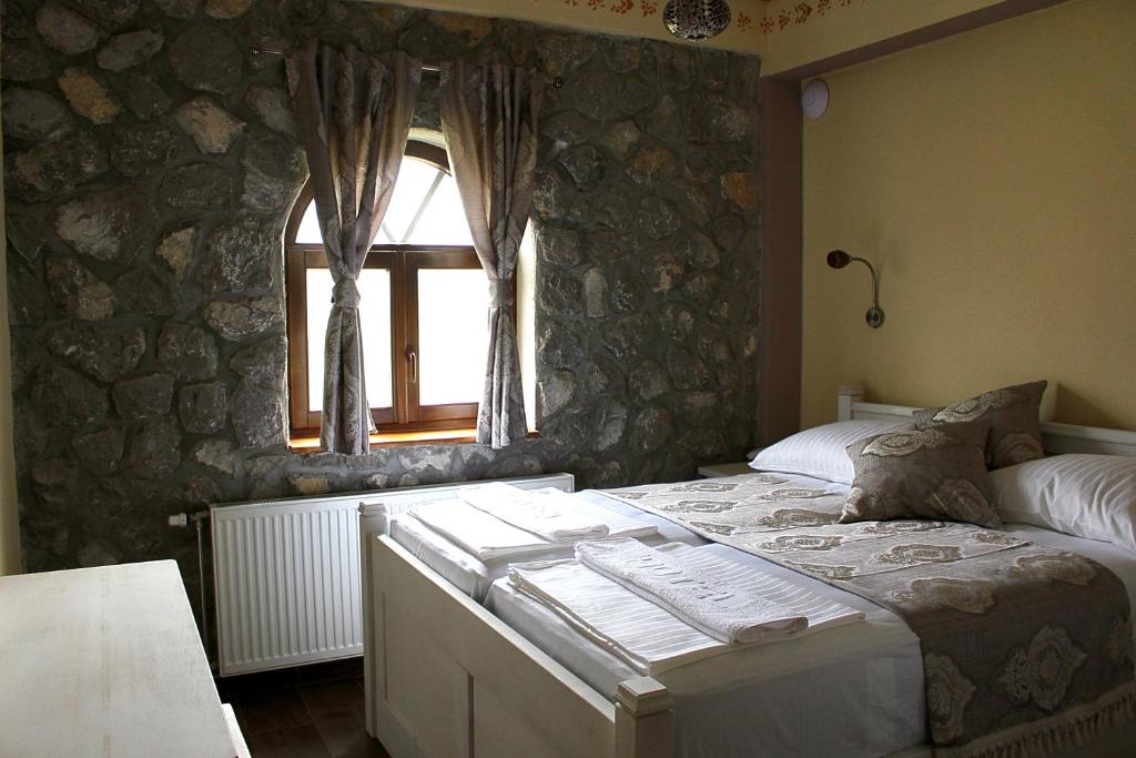 Postel nebo postele na pokoji v ubytování Hotel Divan