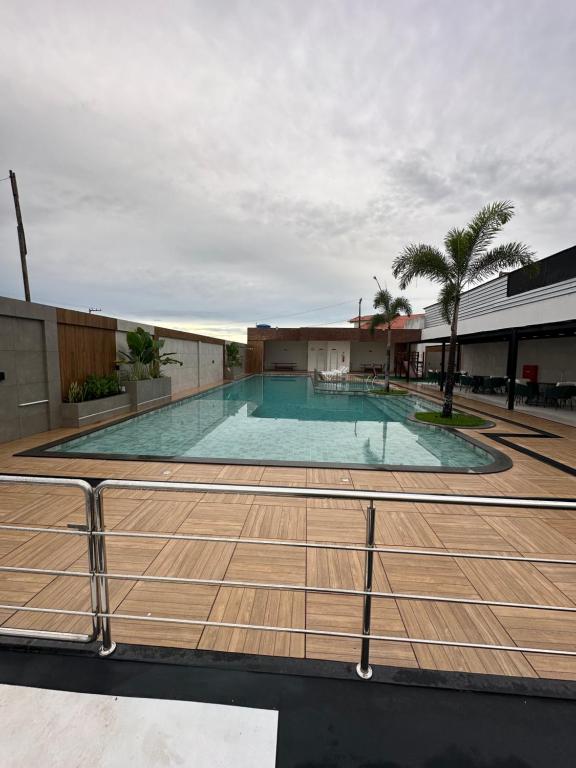 a large swimming pool on top of a building at Apartamento completo em Salinópolis in Salinópolis