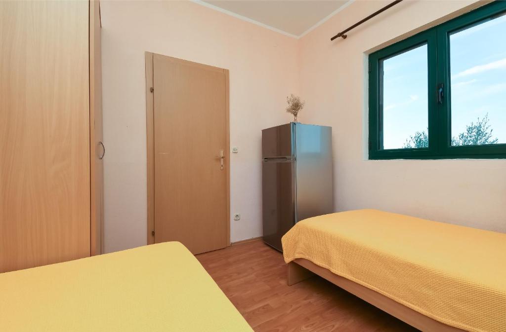 Łóżko lub łóżka w pokoju w obiekcie Apartments Toni