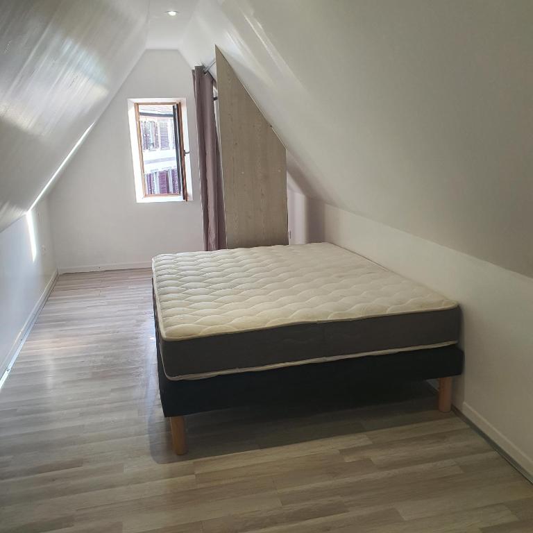 Postel nebo postele na pokoji v ubytování Studio atypique avec superbe vue
