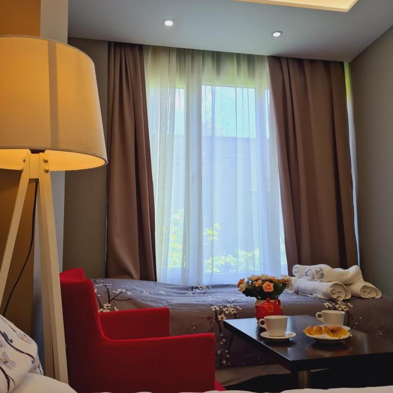Postel nebo postele na pokoji v ubytování Driti Hotel & Apartments