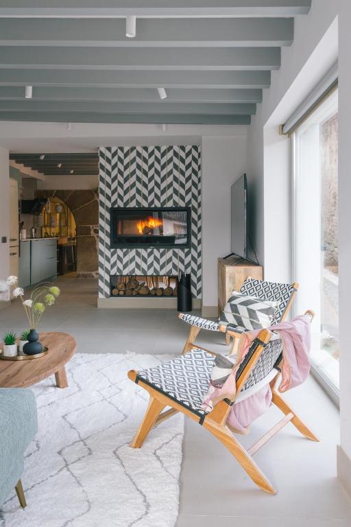 a living room with a chair and a fireplace at LacasaDFontibre in Fontibre