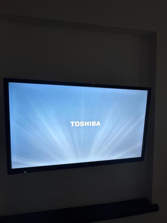 Televízia a/alebo spoločenská miestnosť v ubytovaní Luxury Rooms Dino
