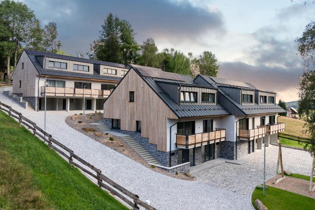 an image of a house with a barn at Resort Alpalouka in Špičák