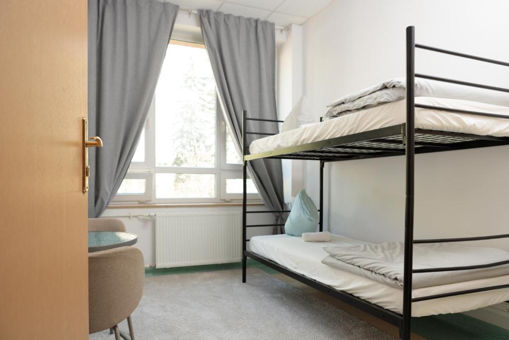 Postel nebo postele na pokoji v ubytování Alliance Hostel