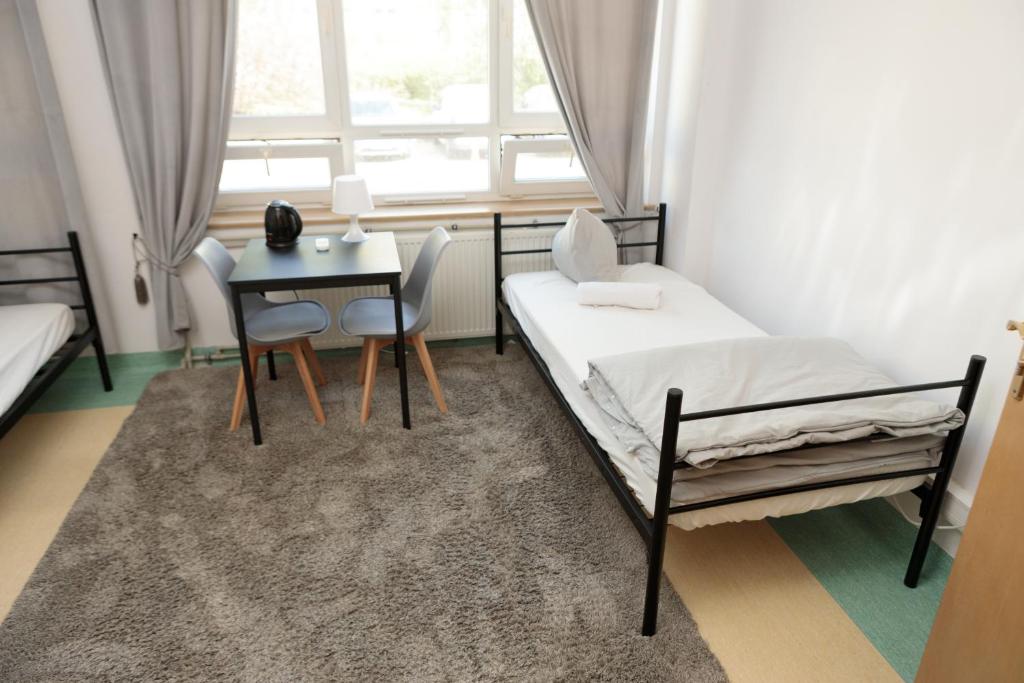 Postel nebo postele na pokoji v ubytování Alliance Hostel