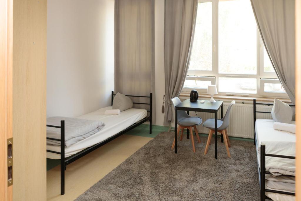 Postel nebo postele na pokoji v ubytování Alliance Hostel