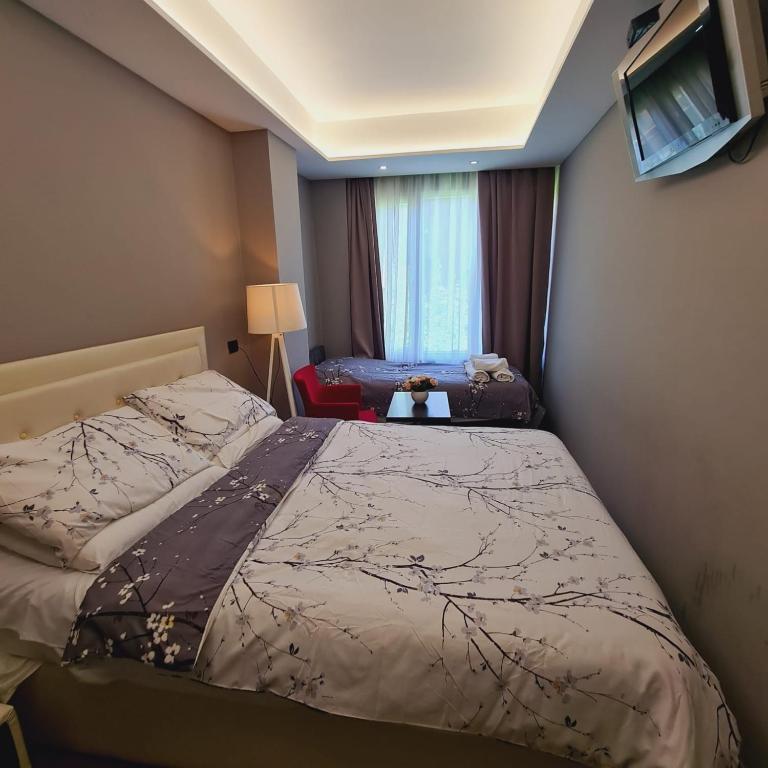 Postel nebo postele na pokoji v ubytování Driti Hotel & Apartments