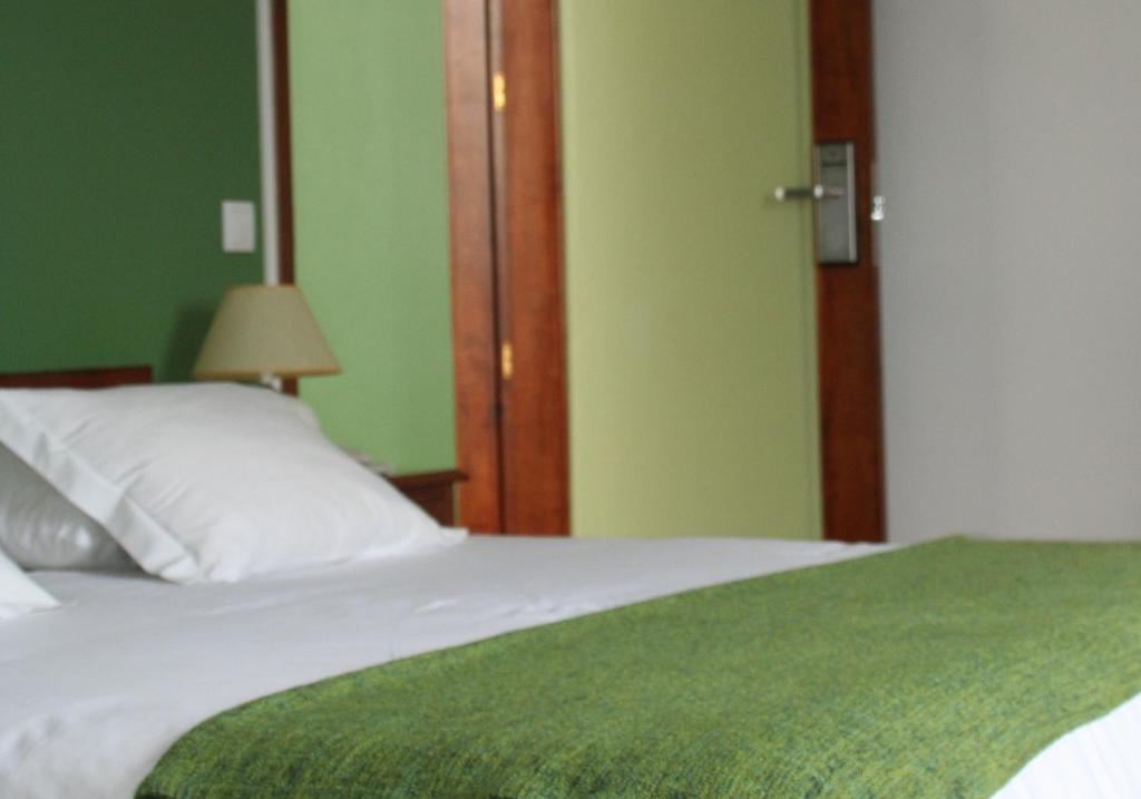 Postel nebo postele na pokoji v ubytování Hotel Alcides