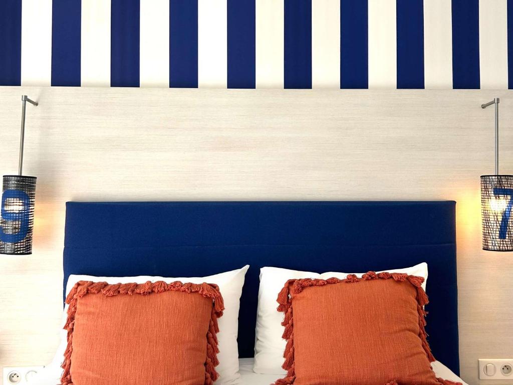 Postel nebo postele na pokoji v ubytování ibis Styles Quiberon Centre