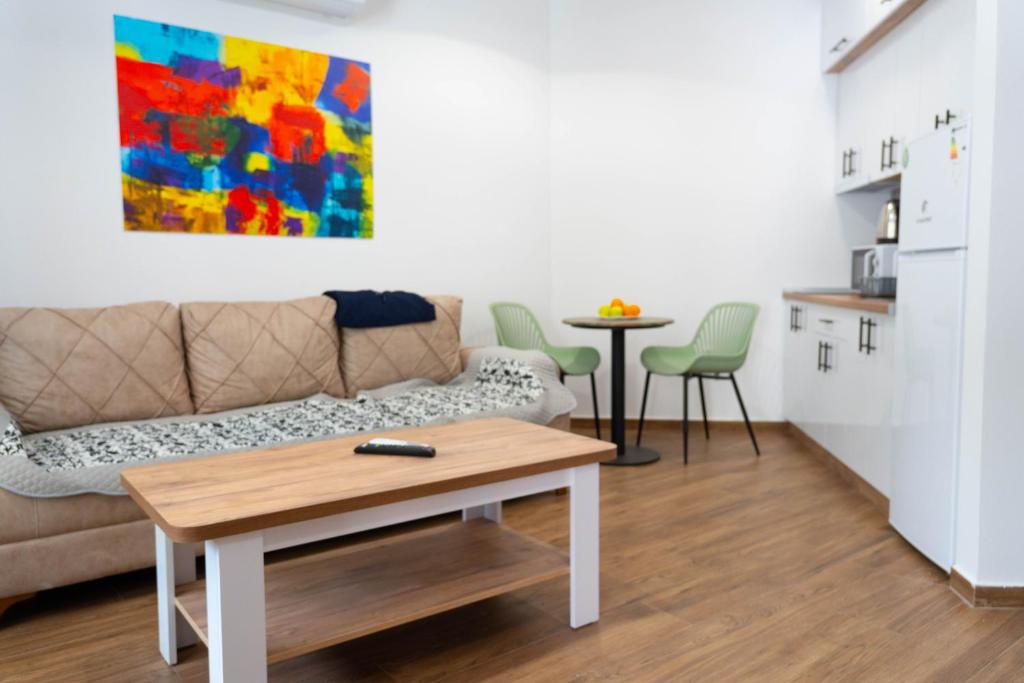 a living room with a couch and a table at Urban Stay - Main Area Apartments in Skopje